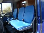 Cab shot of an Iveco build showing the re-upholstery of the cab seating to match the living colour scheme. All colours are chosen by the client with a wide range of colours available.