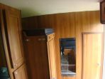 This image is of a Thorpe Olympian 3 stall 7.5 ton build and shows the over room auxillary bed in the stowed position